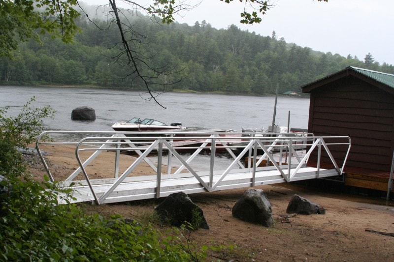 TechniDock aluminum gangway going to boathouse on misty lake