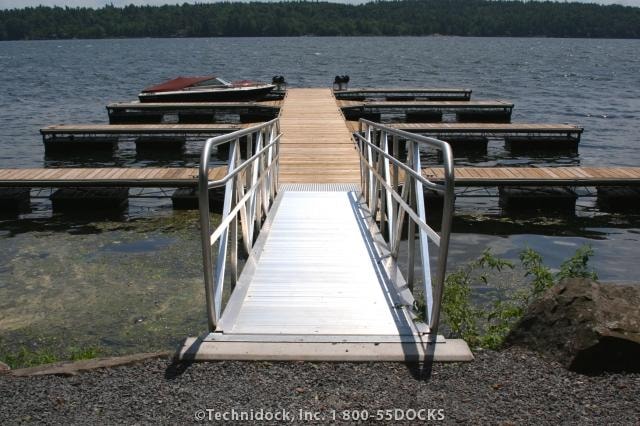 TechniDock aluminum gangway leading to floating dock on lake