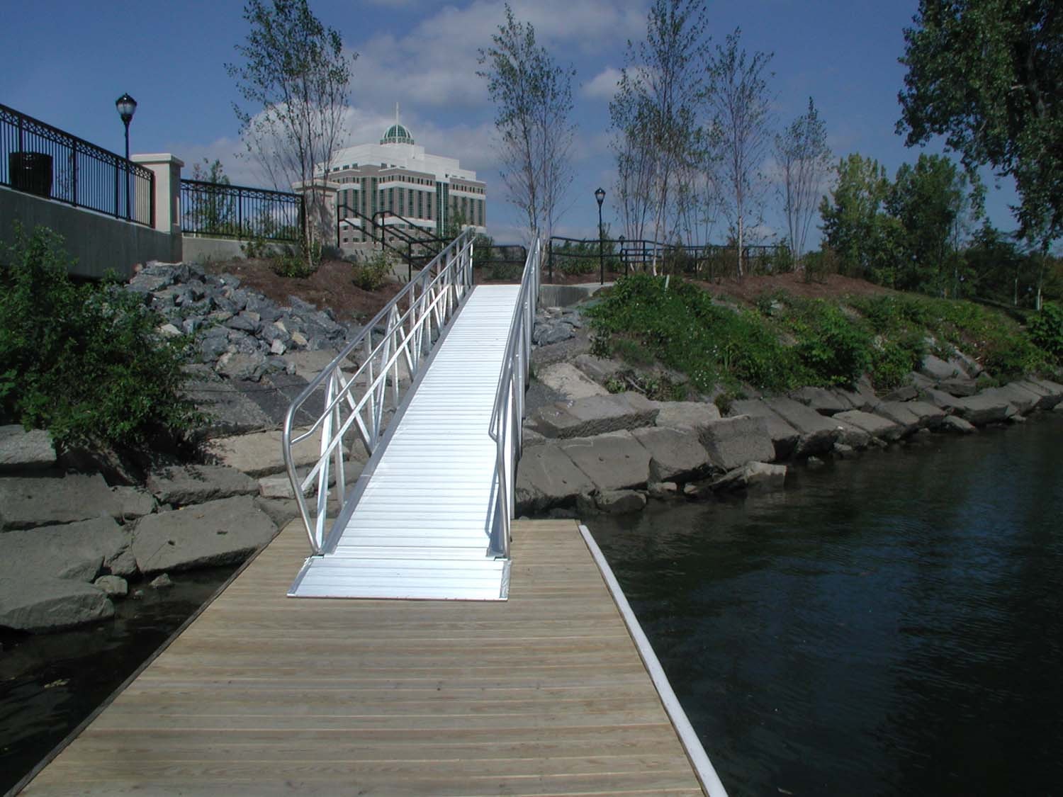 TechniDock aluminum gangway ramp from floating dock to rocky shoreline